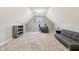 Spacious bonus room with vaulted ceiling, neutral decor, and comfortable seating area at 9956 Hickory Ridge Dr, Zionsville, IN 46077