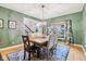 The dining room features a wooden table, patterned rug, and window at 9956 Hickory Ridge Dr, Zionsville, IN 46077