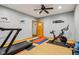 Exercise room with treadmill, stationary bike, and natural light at 9956 Hickory Ridge Dr, Zionsville, IN 46077