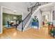 Bright foyer showcasing the staircase, dining room, and hallway at 9956 Hickory Ridge Dr, Zionsville, IN 46077