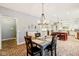 Charming dining area adjacent to an open kitchen featuring brick floors and stylish decor at 9956 Hickory Ridge Dr, Zionsville, IN 46077