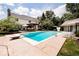 Backyard swimming pool with diving board, patio space, and outdoor seating at 9956 Hickory Ridge Dr, Zionsville, IN 46077