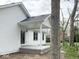 Back porch of this home with white siding and sliding glass doors at 103 N Brenrich Rd, Pendleton, IN 46064