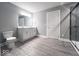 Bathroom with a double sink vanity, and a glass-enclosed shower, providing a modern feel at 103 N Brenrich Rd, Pendleton, IN 46064