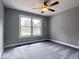 Bedroom with carpet and a window overlooking the yard at 103 N Brenrich Rd, Pendleton, IN 46064
