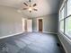 Spacious bedroom featuring carpet, large windows, and a ceiling fan at 103 N Brenrich Rd, Pendleton, IN 46064
