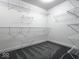 Walk-in closet provides ample storage with shelving along the walls and soft carpet at 103 N Brenrich Rd, Pendleton, IN 46064