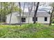 Charming home boasts a well-manicured lawn and inviting curb appeal, surrounded by trees at 103 N Brenrich Rd, Pendleton, IN 46064
