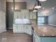 Granite countertops and stainless steel appliances adorn the open kitchen and bar area at 103 N Brenrich Rd, Pendleton, IN 46064