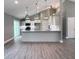 Bright kitchen with white cabinets, stainless appliances, and a granite countertop island at 103 N Brenrich Rd, Pendleton, IN 46064