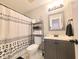 Modern bathroom with black fixtures, shower curtain, and stylish design at 10921 Walnut Grv, Camby, IN 46113