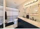 Bathroom featuring double sinks, modern lighting, and stylish fixtures at 10921 Walnut Grv, Camby, IN 46113