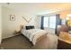 Bright bedroom with natural light, neutral walls, and a patterned comforter at 10921 Walnut Grv, Camby, IN 46113