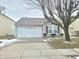 Charming single-story home featuring an attached two-car garage and a well-kept front yard at 10921 Walnut Grv, Camby, IN 46113