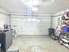 A spacious garage features a large white door, ample storage space, and concrete flooring at 10921 Walnut Grv, Camby, IN 46113