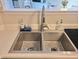 Functional stainless steel kitchen sink, ready for dishwashing and food prep, with a stylish faucet and organized accessories at 10921 Walnut Grv, Camby, IN 46113
