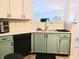 Well-lit kitchen offering a glimpse into the living space, creating an open and inviting atmosphere for cooking and socializing at 10921 Walnut Grv, Camby, IN 46113