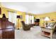 Bright living room with furniture, neutral carpet, and large windows at 11077 Ellsworth Ln, Fishers, IN 46038