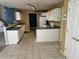 Functional kitchen features ample counter space, white cabinets, and essential appliances for your culinary needs at 1148 Nanwich Ct, Indianapolis, IN 46217