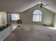 Bright living area with a large arched window and plenty of space for furniture, ready for your personal touch at 1148 Nanwich Ct, Indianapolis, IN 46217