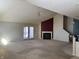 Spacious living room with a fireplace and sliding glass doors, creating a warm and inviting atmosphere at 1148 Nanwich Ct, Indianapolis, IN 46217