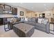 Cozy basement entertainment area with comfortable seating, built-in shelving, and recessed lighting at 11620 Willow Springs Dr, Zionsville, IN 46077