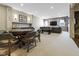 Basement game room featuring a foosball table, a poker table and wet bar at 11620 Willow Springs Dr, Zionsville, IN 46077