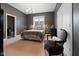 Comfortable bedroom with soft lighting, neutral colors, and a cozy chair, creating a peaceful and inviting retreat at 11620 Willow Springs Dr, Zionsville, IN 46077
