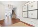 Grand foyer featuring hardwood floors, a statement light fixture, and staircase at 11620 Willow Springs Dr, Zionsville, IN 46077