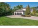 Three-car garage on a large lot with mature landscaping and plenty of parking at 11620 Willow Springs Dr, Zionsville, IN 46077