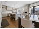Open kitchen featuring an eat-in island, hardwood floors, and ample cabinet space at 11620 Willow Springs Dr, Zionsville, IN 46077