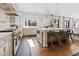 Bright kitchen featuring a central island, pendant lighting, and stainless steel appliances at 11620 Willow Springs Dr, Zionsville, IN 46077
