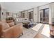 Comfortable living room featuring hardwood floors and patio access at 11620 Willow Springs Dr, Zionsville, IN 46077