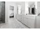 Elegant bathroom featuring marble countertops, custom cabinetry, and a glass-enclosed shower at 11620 Willow Springs Dr, Zionsville, IN 46077
