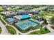 An aerial view showcases tennis courts, a pool, and the community center at 1225 Stonehaven Dr, Westfield, IN 46074