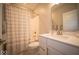 Bathroom with tub and shower, white vanity with quartz countertop, and modern fixtures at 1225 Stonehaven Dr, Westfield, IN 46074
