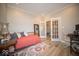 Comfortable bedroom with a daybed, stylish rug, and neutral decor, perfect for relaxation or a home office at 1225 Stonehaven Dr, Westfield, IN 46074
