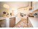 Open kitchen with stainless steel appliances, large island, and modern finishes at 1225 Stonehaven Dr, Westfield, IN 46074