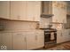 Well-lit kitchen with stainless steel appliances, white cabinetry, and subway tile backsplash at 1225 Stonehaven Dr, Westfield, IN 46074