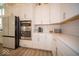 Bright kitchen featuring stainless steel appliances, ample cabinetry, and light countertops at 1225 Stonehaven Dr, Westfield, IN 46074