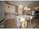 Modern kitchen featuring an island with bar stools and open concept to the living area at 1225 Stonehaven Dr, Westfield, IN 46074
