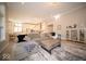 Open-concept living room with hardwood floors, a fireplace, and ample seating at 1225 Stonehaven Dr, Westfield, IN 46074