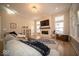 Spacious living room featuring a fireplace, large windows, and hardwood flooring at 1225 Stonehaven Dr, Westfield, IN 46074