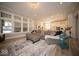 Spacious open-concept living room with hardwood flooring and large windows at 1225 Stonehaven Dr, Westfield, IN 46074