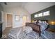 Inviting main bedroom with a bed, stylish rug, and a wood accent wall, creates a relaxing and cozy atmosphere at 1225 Stonehaven Dr, Westfield, IN 46074