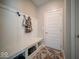 Functional mudroom with built-in bench, storage cubbies, and coat hooks at 1225 Stonehaven Dr, Westfield, IN 46074