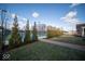 Community tennis courts surrounded by lush landscaping and clear blue sky at 1225 Stonehaven Dr, Westfield, IN 46074