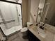 Modern bathroom with a tiled shower and a sleek vanity with a stone countertop at 12889 Girvan Way, Fishers, IN 46037