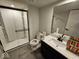Modern bathroom with a glass-enclosed shower, a sleek vanity, and contemporary fixtures at 12889 Girvan Way, Fishers, IN 46037