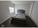 Neat bedroom with a comfy bed, tufted headboard, and a window letting in natural light at 12889 Girvan Way, Fishers, IN 46037